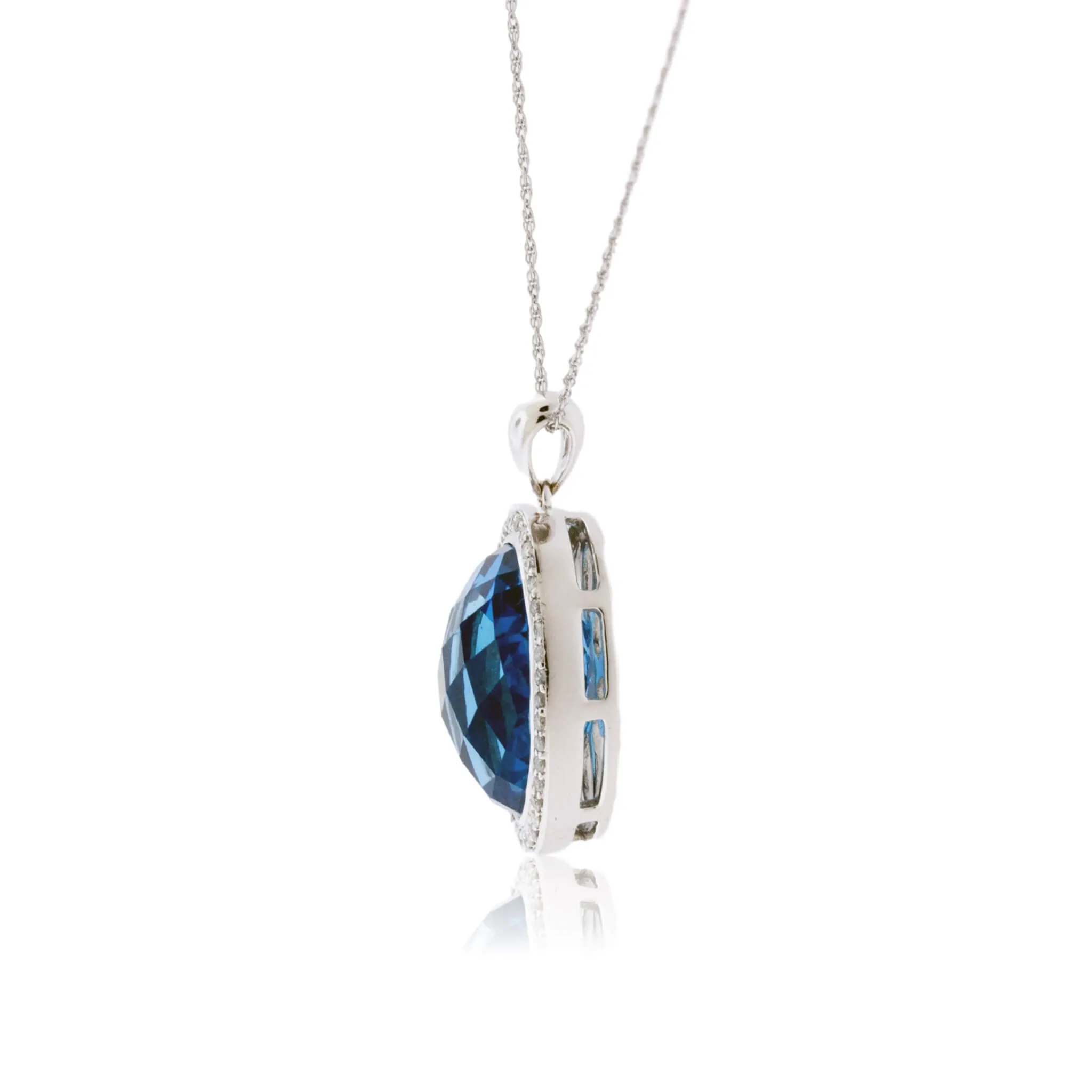 Oval Blue Topaz & Diamond Halo Pendant